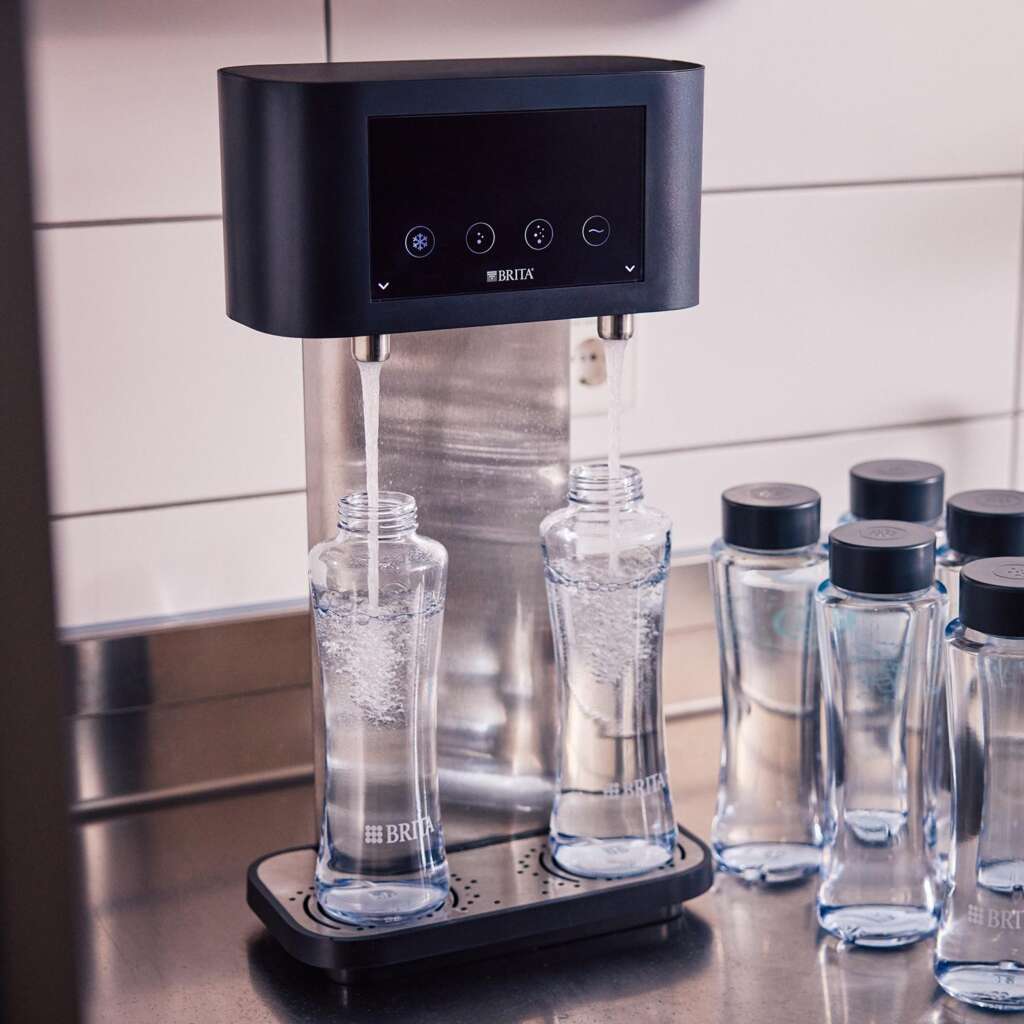 BRITA Fill T-Tap dispenser TwinFilling two reusable glass bottles simultaneously during peak service